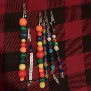 A variety of “roach clips” or cigarette holders